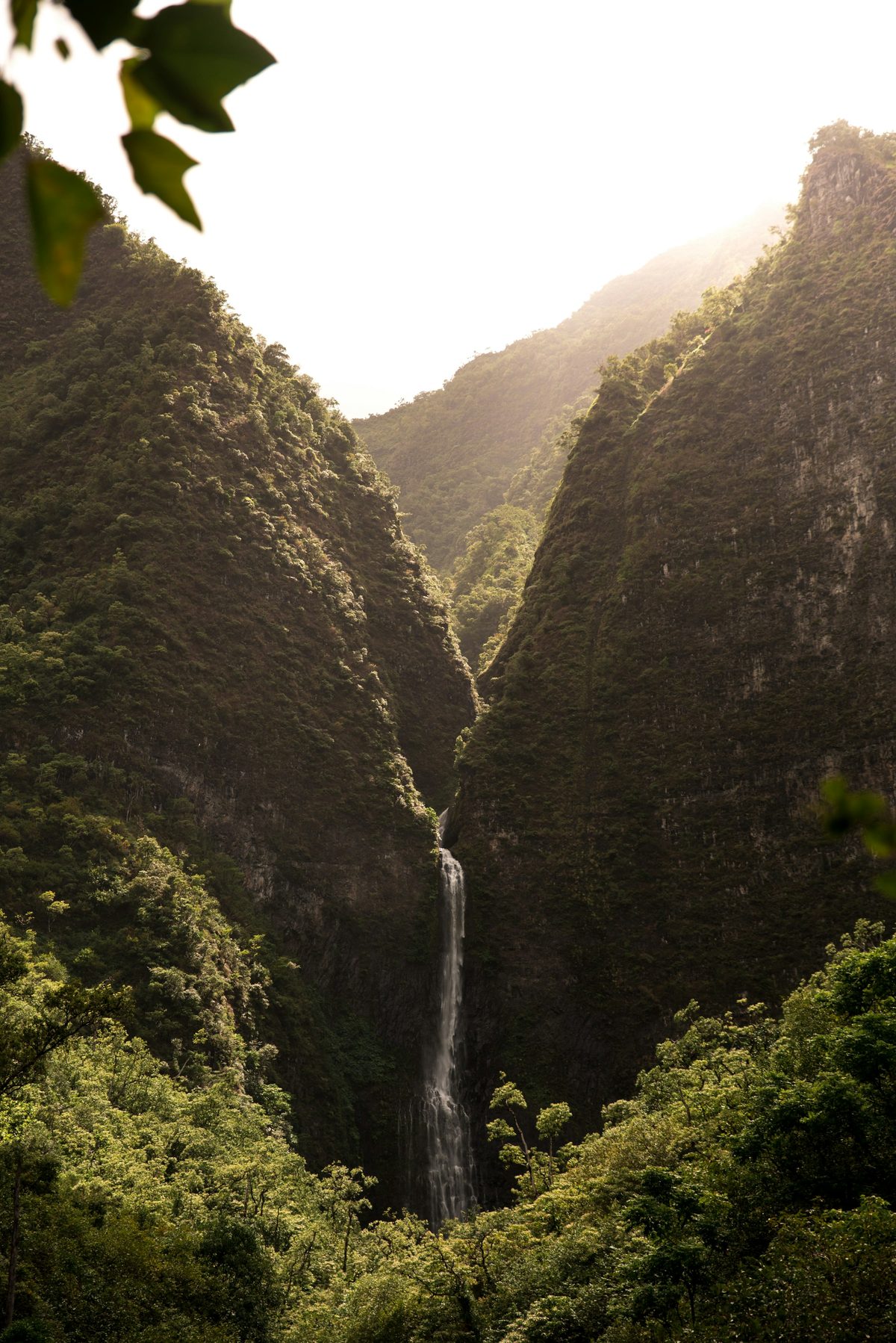 Waterfalls in Kauai's interior mountains, a popular day-trip sight (stock photo, not the property)