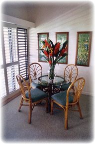 Dining area adjacent to the fully equipped kitchen at Kiahuna 22